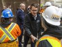 Ontario's labor minister, Monte McNaughton, shakes hands with workers at the LiUNA training center in London on March 15, 2023. Mike Hensen/The London Free Press