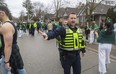 London police clear the crowds off Broughdale Avenue after more than a 1,000 students gathered to celebrate St. Patrick's Day on Friday, March 17, 2023. (Mike Hensen/The London Free Press)