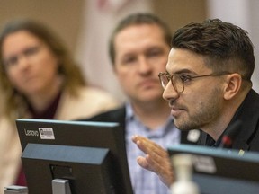 Coun. Skylar Franke, left, and Mayor Josh Morgan listen to Coun. David Ferreira bring forward a motion during a city council committee meeting on Tuesday, March 21, 2023, to get more information on Thames pool by June.  (Mike Hensen/The London Free Press)