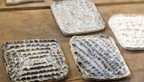 Fingerprints create different patterns in tiles that were recently fired and glazed.