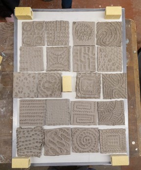 Clay tiles, with patterns usually made with fingers and hands, will be fired in a kiln for 24 hours, before a glaze is added and they are fired again.
