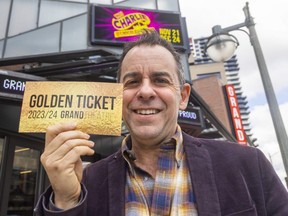 Dennis Garnhum, artistic director at the Grand Theatre, holds a "golden ticket" in a nod to Willy Wonka and the Chocolate Factory, the holiday offering they'll stage this December. Photo taken on Tuesday March 28, 2023. 
Mike Hensen/The London Free Press