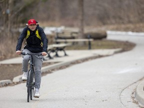 Arkadiusz Broniarz, 39, of London is nearing 1,000 straight days of biking at least 30 kilometres a day in Southwestern Ontario. His goal is to reach 100,000 kilometres while sharing motivational posts and eye-catching drone photography on social media. Photograph taken on Wednesday, March 29, 2023. (Mike Hensen/The London Free Press)