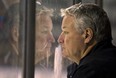 London Knights head coach Dale Hunter fogs up the glass as he stares intently at a scrimmage during their training camp at Budweiser Gardens on Wednesday Aug 28, 2013. (MIKE HENSEN/The London Free Press)