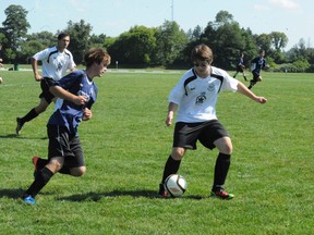 Simcoe and  District Youth Soccer Club players compete against each other in this Postmedia file photo.