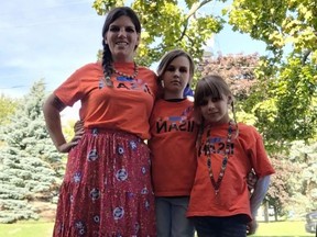 Patricia Marshal, left, director of the Ingersoll and area Indigenous Solidarity and Awareness Network (IISAN), stands with her 10-year-old daughter Fae and seven-year-old daughter Rune. (Submitted)