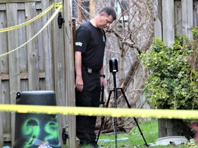 A London police forensic investigator collects evidence at 856 Redoak Ave. as part of a homicide investigation on Friday, April 21, 2023. Police called to the home Thursday found a seriously injured 69-year-old woman who was pronounced dead. (Dale Carruthers/The London Free Press)