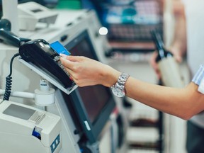 Buying food at a grocery store self-checkout (File photo)