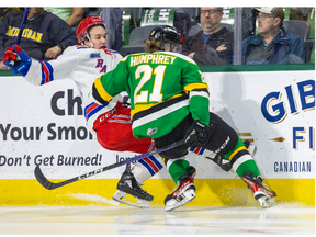 Ryan Humphrey of the London Knights hits Tomas Hamara of the Kitchener Rangers during Game 1 of their second-round OHL playoff series at Budweiser Gardens in London on Thursday April 13, 2023. Mike Hensen/The London Free Press