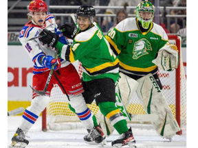 Isaiah George of the London Knights clears the crease, getting Cameron Mercer of the Kitchener Rangers out of the way for Knights goalie Brett Brochu to have a clean look at pucks during Game 2 of their second-round OHL playoff series on Friday April 14, 2023. Mike Hensen/The London Free Press