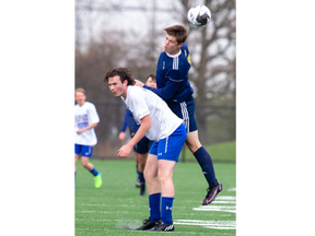 St. Joseph's Catholic high school's Cailan Toal gets his head on the ball while competing with Parkside Collegiate's Guistin Lattanzio during their high school exhibition match at 1Password Park in St. Thomas on Tuesday April 25, 2023. (Derek Ruttan/The London Free Press)