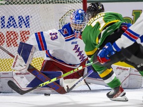 Easton Cowan of the London Knights can’t quite get the puck onto his forehand around the outstretched pad of Kitchener Rangers goalie Marco Costantini in Game 5 of their second-round OHL playoff series at Budweiser Gardens in London on Thursday April 20, 2023. Mike Hensen/The London Free Press