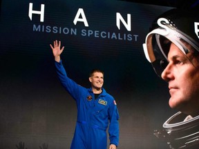 Astronaut Jeremy Hansen reacts at a news conference in Houston, Texas, on Monday, April 3, 2023, after being selected for the Artemis II mission that will venture around the moon. (MARK FELIX/AFP via Getty Images)