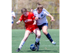 Medway's Lucy Fuhrman battles Lucas player Teegan Garrett during their soccer game at City Wide field in London on Thursday April 27, 2023. (Derek Ruttan/The London Free Press)