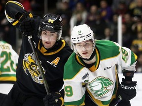 London Knights' Oliver Bonk (59) battles Sarnia Sting's Nolan Burke (86) in front of the Knights' net in the first period at Progressive Auto Sales Arena in Sarnia, Ont., on Friday, Dec. 30, 2022. (Mark Malone/Chatham Daily News/Postmedia Network)