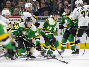 London Knights players Landon Sim (left) and Brody Crane reach for a rebound in the Sarnia Sting's end during their game at Budweiser Gardens in London on Friday April 28, 2023. Derek Ruttan/The London Free Press