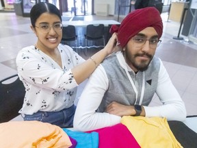 Moneet Tiwana, and her brother, Harpuneet Tiwana, are participating in TurbanUp on Wednesday at the Western University’s community centre. Moneet says it’s an educational day to explain the Sikh religion and why the men wear turbans. People can have their photos taken wearing any colour turban. (Mike Hensen/The London Free Press)