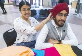 Moneet Tiwana, and her brother, Harpuneet Tiwana, are participating in TurbanUp on Wednesday at the Western University’s community centre. Moneet says it’s an educational day to explain the Sikh religion and why the men wear turbans. People can have their photos taken wearing any colour turban. (Mike Hensen/The London Free Press)