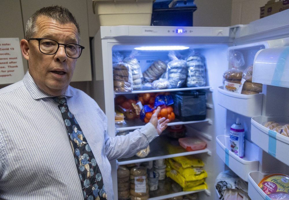 Jeff Holbrough, principal at London's JP Robarts elementary school, shows a fridge full of food paid for in part by the Ontario school nutrition program and President's Choice.  The school hands out 70 to 80 bagels a day to pupils representing 25 to 30 per cent of the school's population, he estimates, and the daily lunch program offers fruit, cheese snacks and yogurt in classroom treat boxes.  (Mike Hensen/The London Free Press)