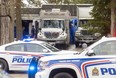 Police vehicles crowd the entrance to 467 Commissioners Rd. E. on Wednesday, April 5, 2023, as officers dismantled a "large, complex" illegal cannabis extraction lab found in the house Tuesday. (Mike Hensen/The London Free Press)