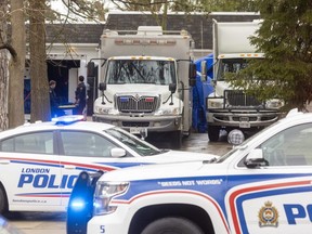 Police vehicles crowd the entrance to 467 Commissioners Rd. E. on Wednesday, April 5, 2023, as officers dismantled a "large, complex" illegal cannabis extraction lab found in the house Tuesday. (Mike Hensen/The London Free Press)