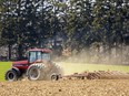 Peter Klassen of Debackere Farm Market near Port Stanley cultivates a field on Monday, April 10, 2023. He hopes to plant sweet corn – under plastic to protect it from frost – this week. (Mike Hensen/The London Free Press)