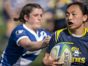 Katelyn D’Costa of the Parkside Stampeders chases the very quick Nadia Van Asseldonk of the St. Joe's Rams in an exhibition high school girls rugby match at 1 Password Park in St. Thomas on Friday, April 14, 2023. (Mike Hensen/The London Free Press)