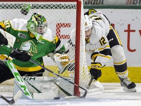 Easton Wainwright of the Sarnia Sting nearly tucks home a wraparound attempt on London Knights goalie Brett Brochu in Game 2 of their OHL Western Conference championship series. Brochu later left the game with an apparent injury. Photo taken on Sunday April 30, 2023. (Mike Hensen/The London Free Press)