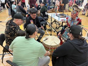 Drummers from London-based Eagle Flight perform the flag song during the grand entry of the powwow at Western University's Indigenous Student Centre on Sunday April 2, 2023. The 17th annual event attracted members of First Nations from across the region.