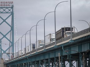 Transport trucks cross the Ambassador Bridge before passing through Canadian customs, on Friday, January 14, 2022. (DAX MELMER/Windsor Star)