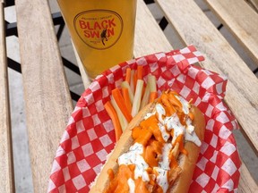 The Hot Wing Dog pairs with an IPA at Black Swan Brewing in Stratford. Steamed hot dogs with creative toppings have become a weekly feature at the Downie Street brewery. (Black Swan photo)