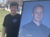 Leanne McPherson of the Queen's Park OPP detachment stands beside a portrait of slain OPP Const. Greg Pierzchala at a memorial bike ride held in Dunnville on Saturday, April 15. McPherson worked with Pierzchala at Queen's Park and was one many people to participate in the ride. VINCENT BALL/BRANTFORD EXPOSITOR