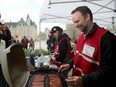 Jean-Paul Surette, a federal public servant with Corrections Canada, has been doling out the hot dogs to fellow picketers in front of the Prime Minister's Office at the corner of Elgin and Wellington Street.