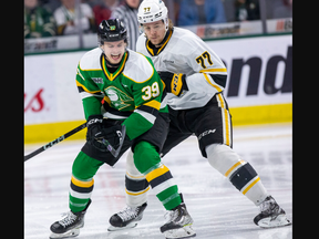 Max McCue of the London Knights competes with the Sarnia Sting's Ethan Del Mastro in Game 1 of the OHL Western Conference final at Budweiser Gardens in London on April 28, 2023. (Derek Ruttan/The London Free Press)