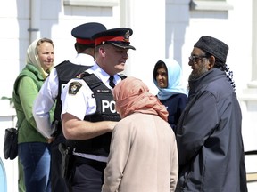 Police speak to members of a Markham, Ont., mosque on April 10, 2023 about an attack that occurred the previous Thursday. A second similar but unconnected incident occurred at a different mosque in Markham a few days after the first.