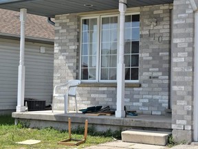 Beer bottles, garbage and broken furniture were visible on Monday, May 15, 2023, in the fallout of a weekend party on Thurman Circle near Fanshawe College that ended with a 15-year-old girl being charged with assaulting a police officer.  (Calvi Leon/The London Free Press)