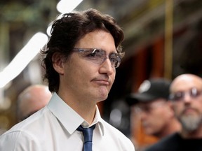 Prime Minister Justin Trudeau wears safety glasses while touring the Stellantis Assembly Plant in Windsor in January 2023  (REUTERS/Rebecca Cook)