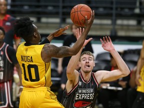 Mike Nuga of the London Lightning shoots past Tanner Stuckman of the Windsor Express in Game 1 of the National Basketball League of Canada championship series at Budweiser Gardens in London on Thursday, May 18, 2023. (Derek Ruttan/The London Free Press)