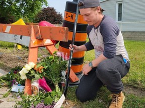 Man places hockey stick at memorial