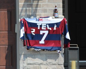 A hockey jersey hung outside a house in Thorndale
