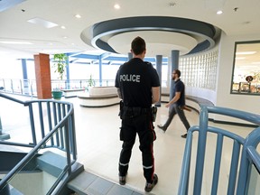 A police resource officer is shown in a Canadian high school in this Postmedia file photo
