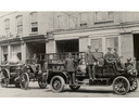 London Fire Department trucks and firefighters are shown along King Street in 1915.