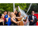 Christine Desjardins and other cast members of Rent celebrate with champagne at the Stratford Festival opening night gala on Tuesday May 30, 2023. Mike Hensen/ The London Free Press