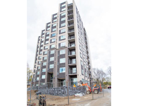 Final construction continues on Monday, May 1, 2023, on a 12-storey highrise at 99 Pond Mills Rd. in London. Half of the units in the highrise are affordable. (Derek Ruttan/The London Free Press)