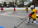 With city hall in the background, the Royals from Brantford played the Defenders from London at Hockeyfest, the road-hockey tournament that brought 130 teams of all ages to downtown London. Photo taken on Sunday May 7, 2023. Jane Sims/The London Free Press