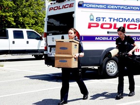 St. Thomas police forensic investigators arrive at the scene of a shooting at a Talbot Street apartment building on Wednesday, May 17, 2023. (Derek Ruttan/The London Free Press)