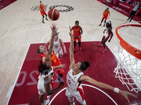 Londoner Miranda Ayim (bottom right) fights for a rebound during a game between Canada and Spain at the Tokyo 2020 Olympic Games on August 1, 2021. (AFP photo)