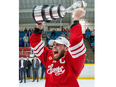 Leamington Flyers captain Gabe Piccolo hoists the Sutherland Cup after defeating the Stratford Warriors, 4-0, in Game 7 of the GOJHL Jr. B hockey championship at Allman Memorial Arena in Stratford on Tuesday May 9, 2023.  Derek Ruttan/The London Free Press