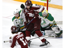Peterborough Petes player Jax Dubois attempts to deflect the puck past London Knights goalie Zach Bowen as Oliver Bonk moves in on defence during Game 4 of the OHL finals at the Peterborough Memorial Centre on Wednesday May 17, 2023. Clifford Skarstedt/ Peterborough Examiner