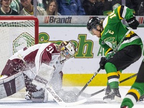 London Knights captain Sean McGurn tries to shove the puck past Peterborough Petes goalie Michael Simpson during the first period of Game 2 of the OHL championship series at Budweiser Gardens in London on Saturday May 13, 2023. Derek Ruttan/The London Free Press/Postmedia Network